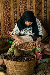 Woman making argan oils and pastes in the Ourika Valley  Morocco  March 2023