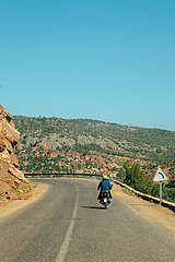 Motorcycle rider in the Ourika Valley  Morocco  March 2023
