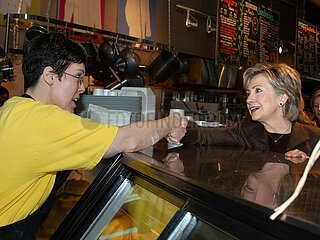 Democratic presidential hopeful Sen. Hillary Rodham Clinton greets supporters and orders breakfast at Palmer s Deli in Des Moines  Iowa  on Saturday  December 8  2007.