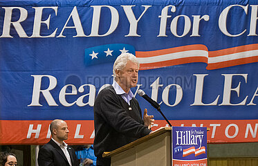 Bill Clinton And Magic Johnson Campaign For Hillary In Iowa