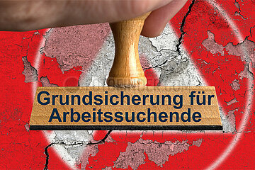 Symbolischer Stempel Grundsicherung fuer Arbeitssuchende
